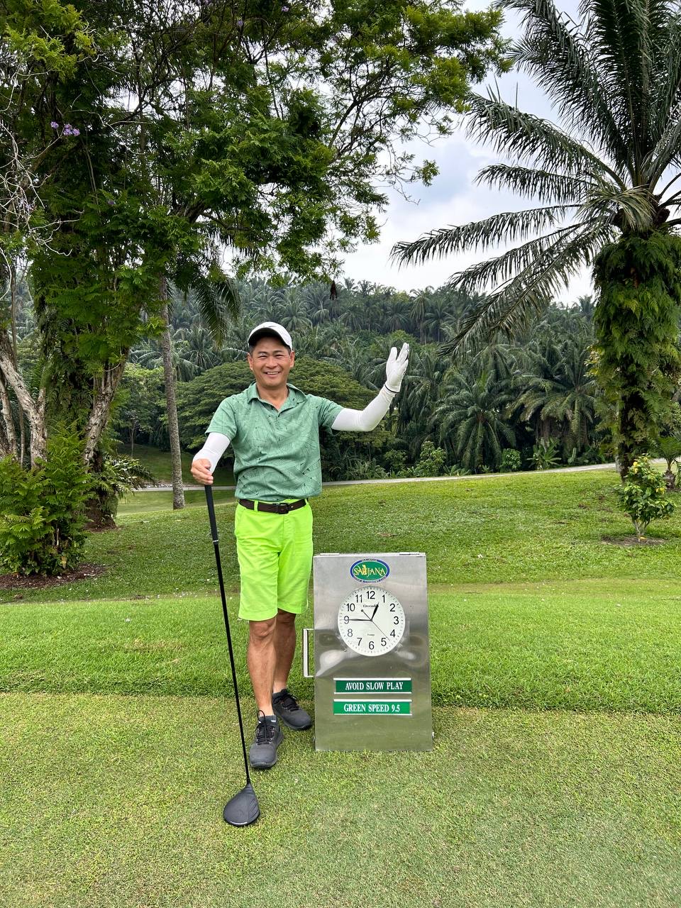 Playing golf at tropical course