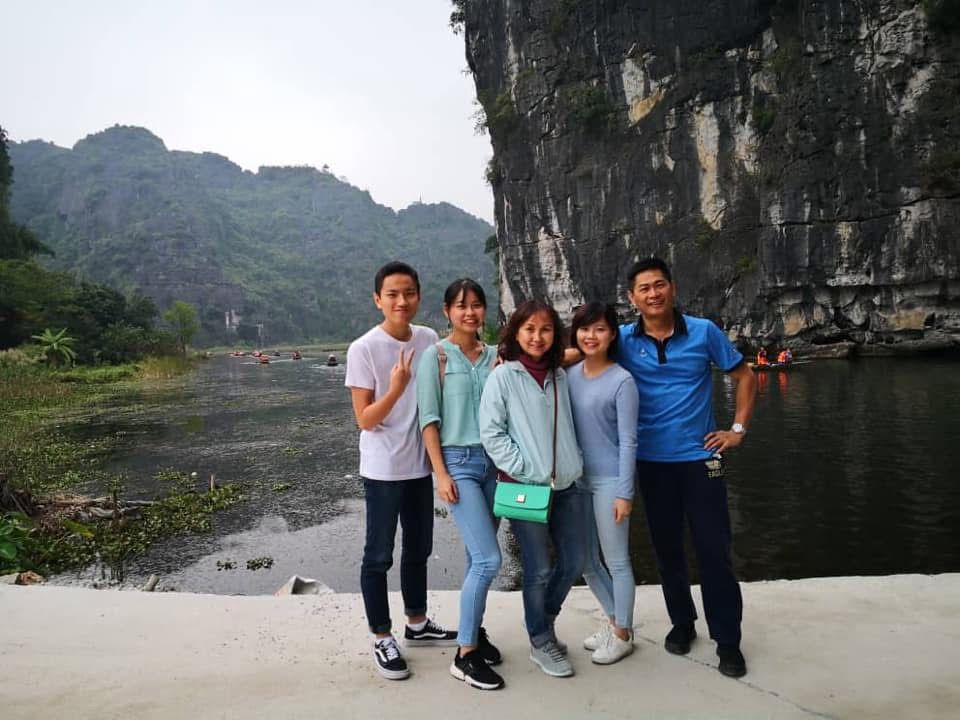 Family trip to Vietnam limestone river scenery